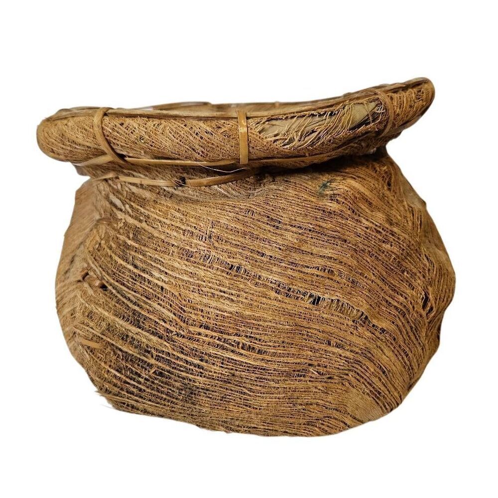 Primitive handmade basket, dried palm leaf woven.